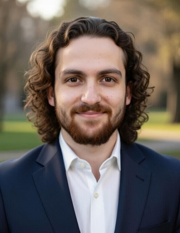 Professional portrait of Evan M Hamilton in blazer